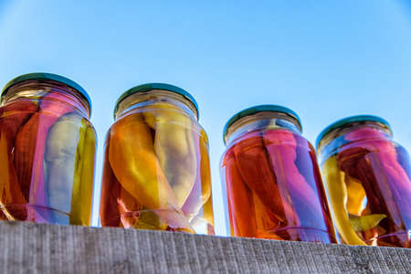 Pickled red in jars for sale outdoorsの写真素材