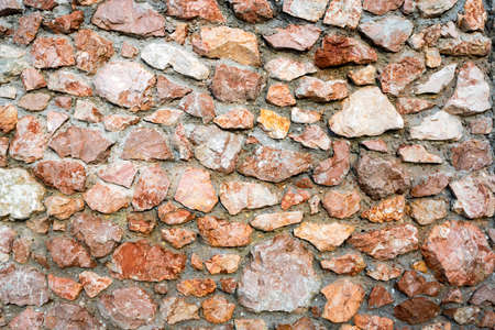 Close up image of decorative beige stonewall textureの写真素材