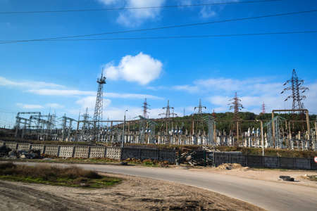 Close view of power towers at electric power stationの写真素材