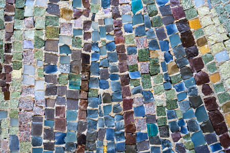 Close up colorful tile in stone wall textureの写真素材