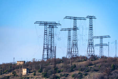 Hill with a lot of power towers at electric power station