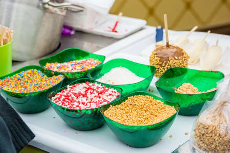 Making chocolate dipped apple close up picture