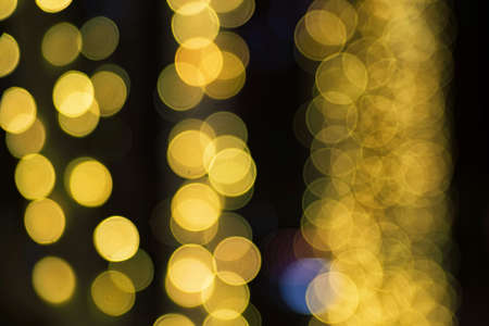 Abstract yellow holiday lights blur for festive backgroundの写真素材