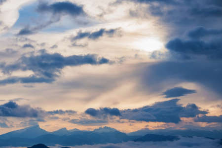 Beautiful distant winter mountains and skyscape with mistの写真素材