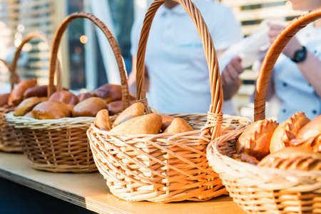 Russian pirozhki, baked patties or pies in basket for saleの写真素材