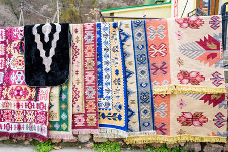 Hand made carpets hanging in street marketの写真素材