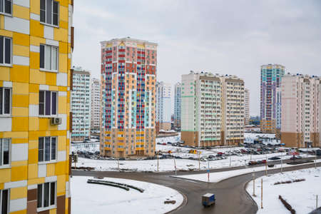 Distant view of a construction site with new buildings in winterの写真素材