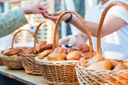 View of market with Russian pirozhki, baked patties or pies on basketsの写真素材