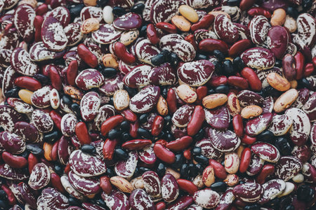 Many strew motley haricot beans. Beans variety. different types of beans background. top view.