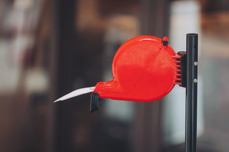 A vibrant red ticket dispenser stands ready, holding a fresh ticket eagerly awaited by visitors. The shop buzzes with life, creating an atmosphere filled with excitement and curios