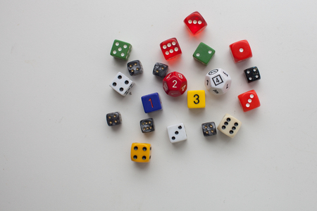Gaming dice rolled on a solid backgroundの写真素材