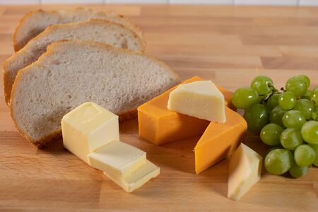 Overview bread and cheese food tray with green grapesの写真素材