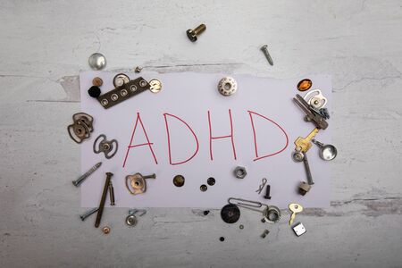 ADHD initialization sign with random metal junk pieces scattered around