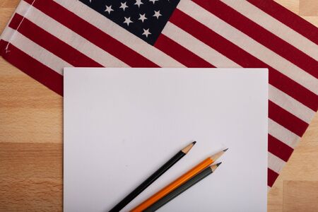 Ready to add text blank paper with American flag In the backgroundの写真素材