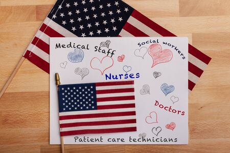 Medical staff appreciation sign with hearts American flags on background