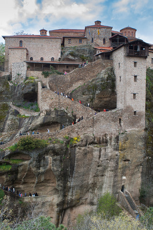 Tourists walking up the stairs into the Holy Monastery Of Great Meteoron in Meteora, Greece.のeditorial素材