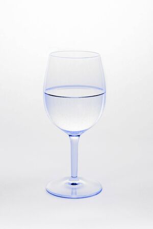 Wine glass filled with water isolated on white backgroundの写真素材