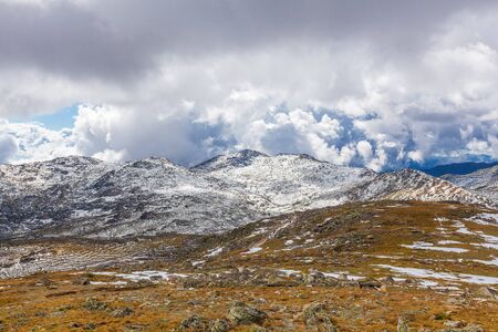 Snow covered mountains under beautiful clouds in Australiaの写真素材