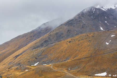 Glowing orange hills of The Remarkables Ski Area, Queenstown, Otago, South Island, New Zealandの写真素材