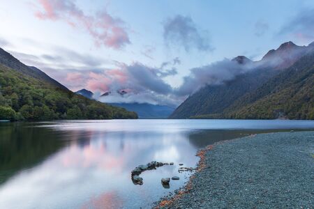 Lake Gunn at sunrise with reflections, Fiordland, South Island, New Zealandの写真素材