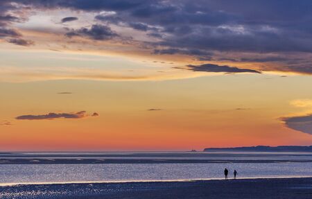 Twho silhouettes on Inverloch foreshore beach at sunset, Gippsland, Victoria, Australiaの写真素材