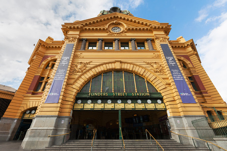 MELBOURNE - JAN 31 2016: Main entrance of Flinders Street Station in Melbourne with clocks showing departure times for trains. No people present in the photograph.のeditorial素材