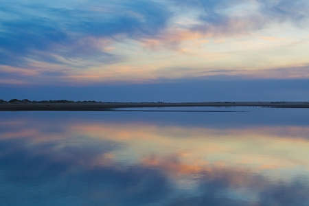 Tranquil dusk time with pastel colored sky reflectin in the sea waters, Australia.の写真素材