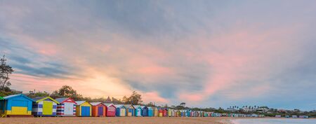 Long row of colorful beach huts and beautiful sunrise. Melbourne, Australiaの写真素材