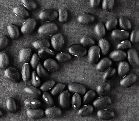 Black turtle beans on dark surface. Top view.の写真素材