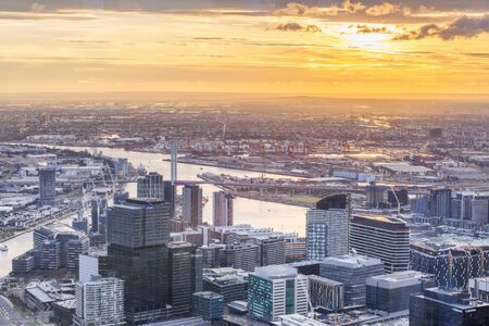 Melbourne, Australia - August 27, 2016: Aerial view of Melbourne CBD with skyscrapers, Yarra River, and Bolte Bridge at sunsetのeditorial素材