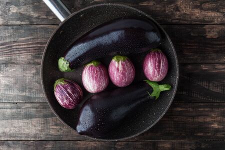 Eggplants sprinkled with water on large frying pan. Top view with copy spaceの写真素材