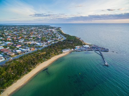 Aerial view of Black Rock suburban area,  coastline, pier and wharf at sunset. Melbourne, Victoria, Australiaの写真素材