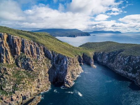 Cape Hauy and Tasman sea on bright sunny day. Tasman National Park, Tasmania, Australia.の写真素材