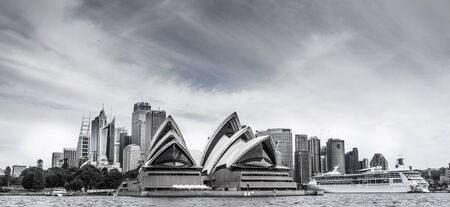 Sydney's Skyline with the Opera House and large cruise ship in the foregroudn, In black and white.のeditorial素材