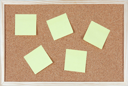 Six post-it notes sticked on corkboard.の写真素材