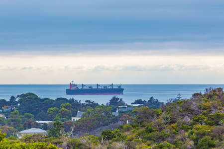 Large cargo vessel sailing in Port Phillip Bay waters. Mornington Peninsula, Melbourne, Australia