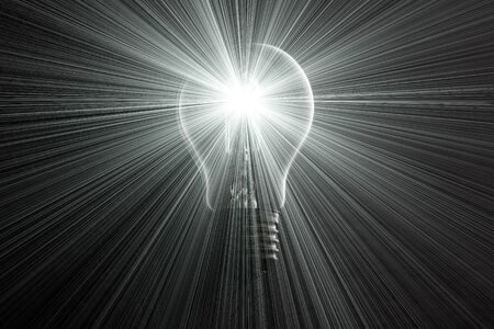 Halogen light bulb on dark background with light rays.の写真素材