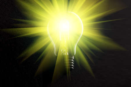 Halogen light bulb on dark background with light rays. .