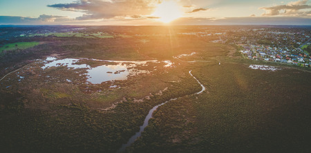 Aerial panorama of mangroves and beautiful rural area at sunset. Melbourne, Australiaの写真素材