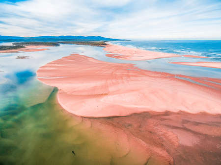 Aerial view of ocean beach at low tide with copy space.の写真素材
