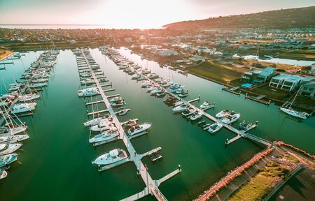 Aerial view of Safety Beach suburb and marina at sunset. Mornington Peninsula, Melbourne Australia
