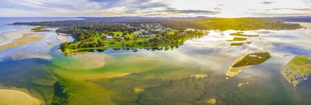Aerial panorama of Mallacoota town and coastline at beautiful sunsetの写真素材