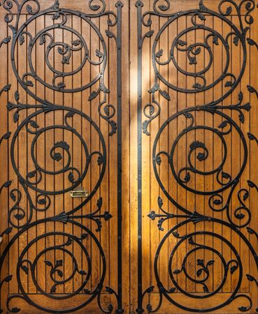 Melbourne, Australia - July 29, 2017: Vintage wooden door with beautiful metal ornamentsのeditorial素材