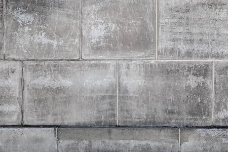 Grungy concrete blocks wall background texture with straight lines