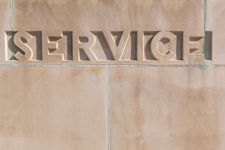 The word SERVICE carved in concrete with copy spaceの写真素材
