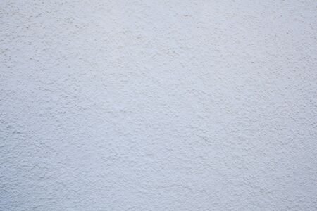 Painted cement wall with white paint. Clean and fresh design for backgrounds and texturesの写真素材