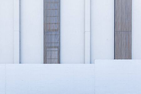 White concrete blocks building exterior fragment for backgrounds and texturesの写真素材