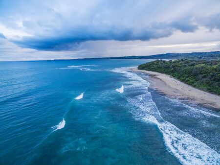 Big storm cloud over ocean waters aerial photographの写真素材