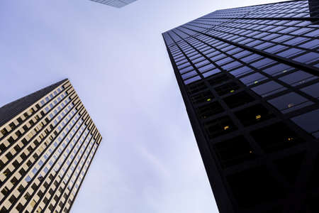 Looking up at tall modern skyscrapers and sky in Melbourne, Australia. Business life concept