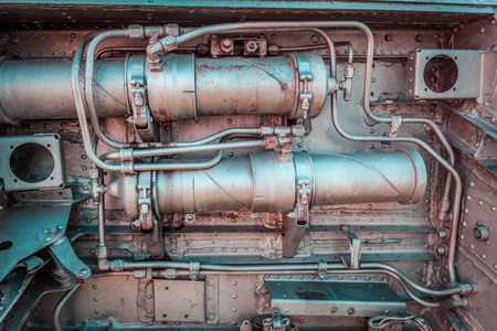 Old aircraft engine closeup with rusty decaying metal pipes and boltsの写真素材
